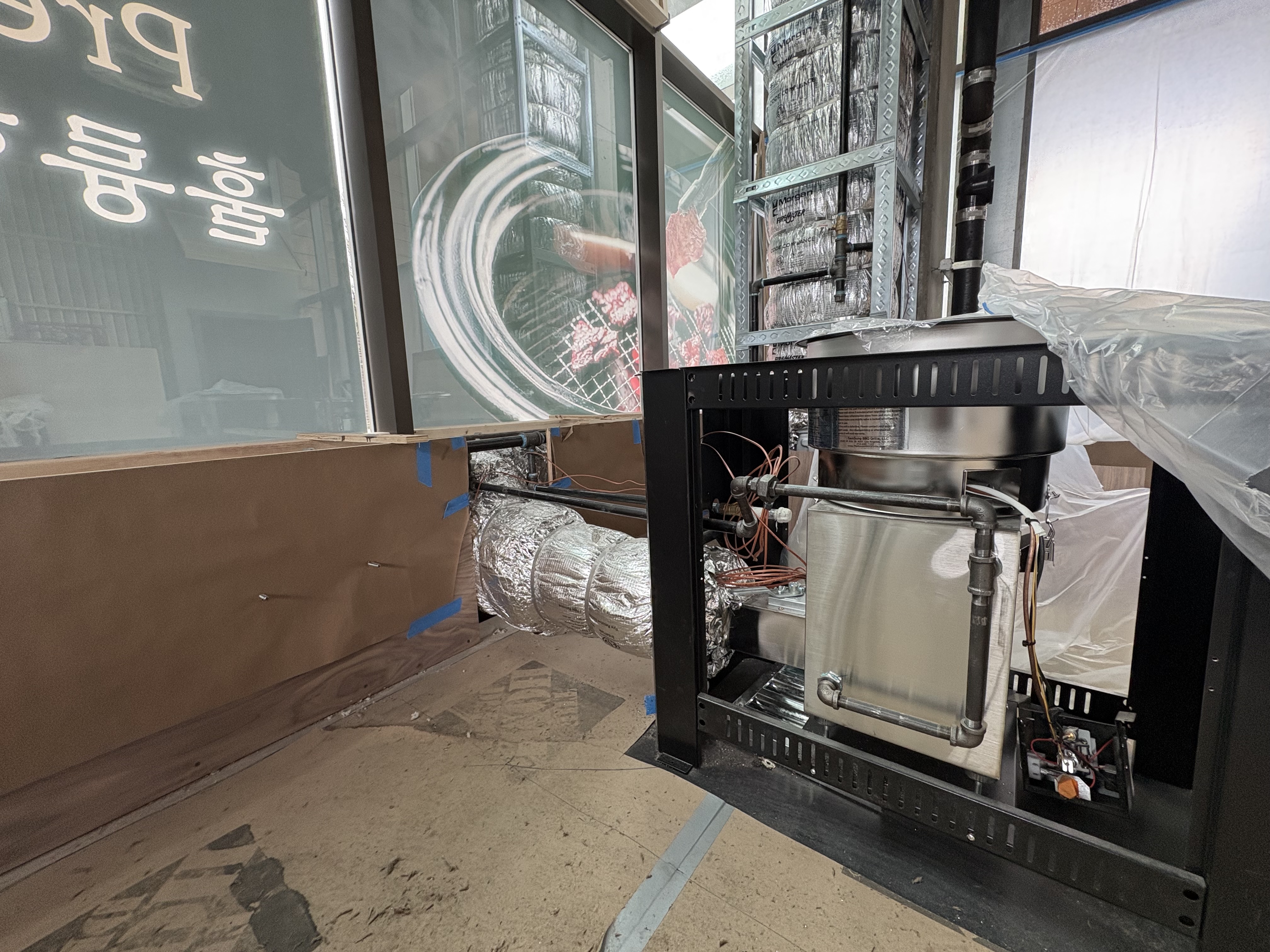 Downdraft ventilation unit being installed at Goban